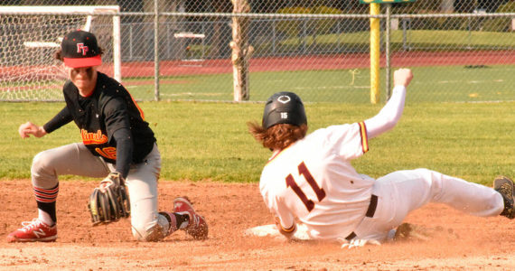 The White River High defeated visiting Franklin Pierce 16-8 last week. Above, Hornet first baseman Tyson Campbell handles an infielder's throw to record an easy out. The regular season wraps up this week for South Puget Sound League 2A baseball teams. Photo by Kevin Hanson