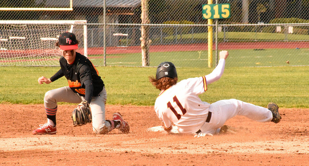The White River High defeated visiting Franklin Pierce 16-8 last week. Above, Hornet first baseman Tyson Campbell handles an infielder’s throw to record an easy out. The regular season wraps up this week for South Puget Sound League 2A baseball teams. Photo by Kevin Hanson