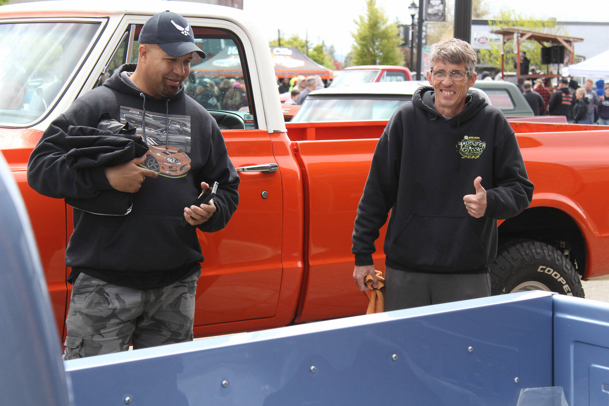 Michael Johnson flashes a smile and a thumbs up as he explains the work he's put into his '69 Chevy Stepside.