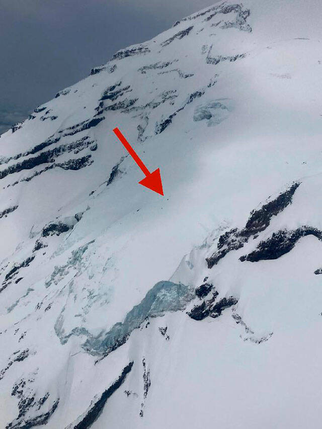 The red arrow indicates the approximate location where a Mount Rainier climber fell into an 80-foot crevasse, requiring a helicopter rescue. Photo courtesy National Park Service