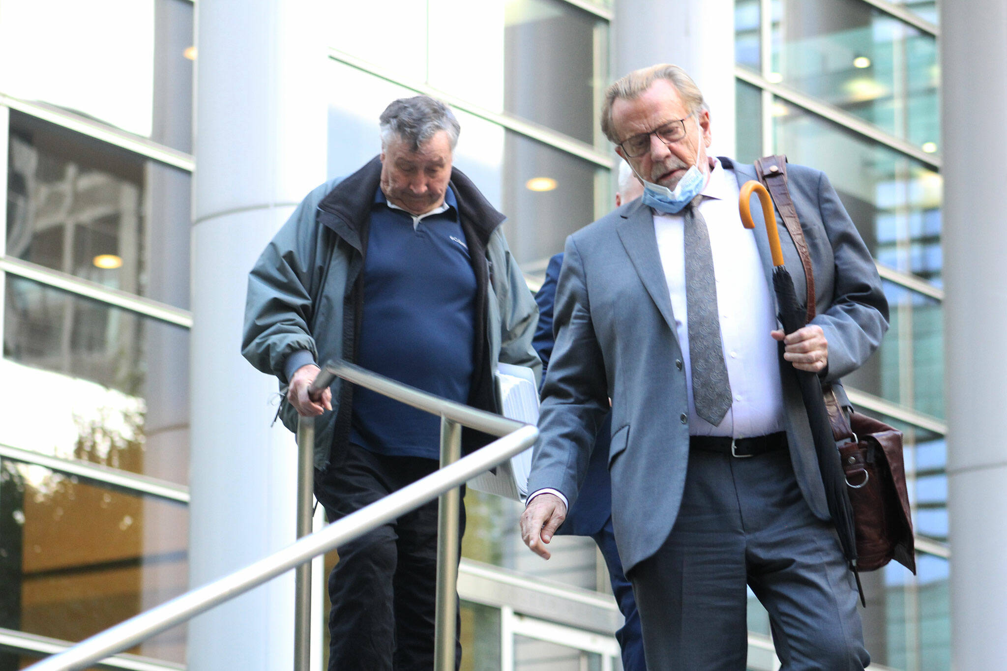 Photo by Ray Miller-Still 
Allan Thomas and his attorney John Henry Browne exit the U.S. District Court building in Seattle following his conviction on several of the counts he was charged with in the drainage district trial.