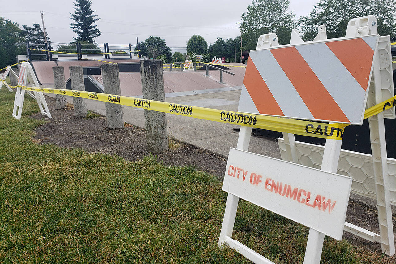 The Enumclaw skate park is closed, and caution tape will soon be replaced with fencing to keep people out until ramps are removed. Photo by Ray Miller-Still