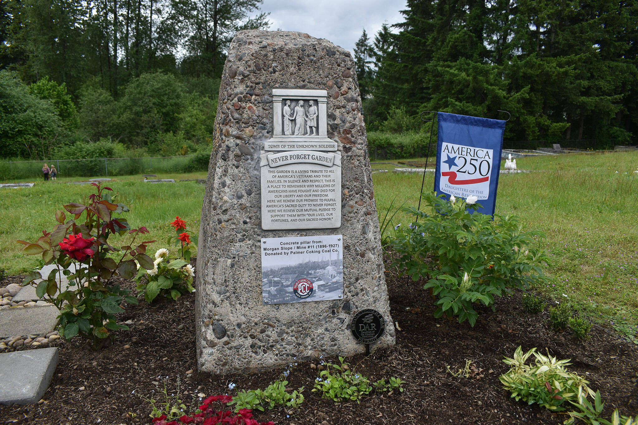 The stone pillar shown here was originally donated by Palmer Coking Coal Co. to the City of Black Diamond, which then donated it to the Never Forget Garden, pictured here on Saturday, June 8. Photo by Alex Bruell.