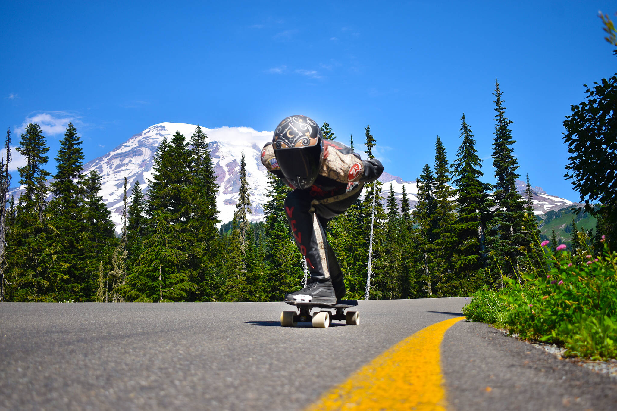 Local skateboarders like Marcie Morgan sometimes train in the Mount Rainier National Park area. When skaters like Morgan go out to practice, they start by scoping out the road – learning how it twists and turns, clearing obstacles like gravel or branches. Low-traffic, one-way roads are ideal and worth taking long drives, she said. Despite your best efforts, you will fall, like Morgan did at a recent qualifier race in Vermont. “I’m fine,” she said: “I banged up my knee a little, but as we say in this sport, if you’re not falling, you’re not learning.” Photo by Alex Bruell.