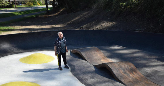 John Hillding stands in the center of the Bacon and Eggs skatepark, which he designed. The Wilkeson skatepark came about from a state grant, Grindline Skateparks, organizing by Hillding and city leaders, and a lot of volunteers. All photos by Alex Bruell