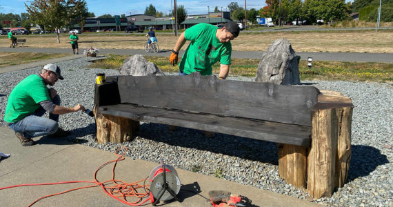 Volunteers in Buckley touched up a Foothills Trail bench during its 2020 event. Photo courtesy Amy Molen