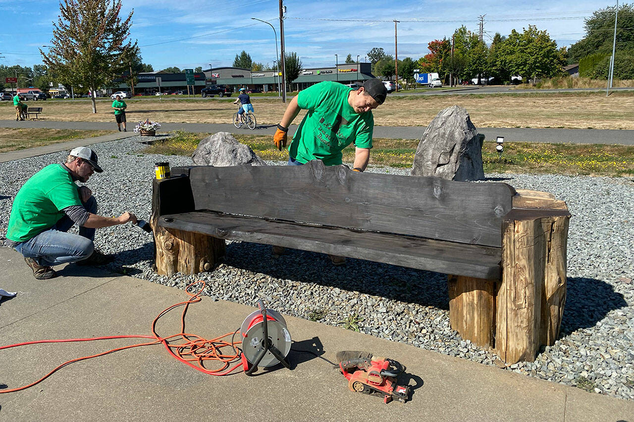 Volunteers in Buckley touched up a Foothills Trail bench during its 2020 event. Photo courtesy Amy Molen