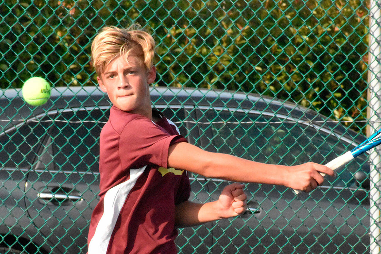 Enumclaw High's Noah Nuttle returns a serve during his Oct. 6 victory over Fife's Tre Sims. The two battled in a No. 1 singles match. Enumclaw went on to defeat the visiting Trojans 3-2. Photo by Kevin Hanson