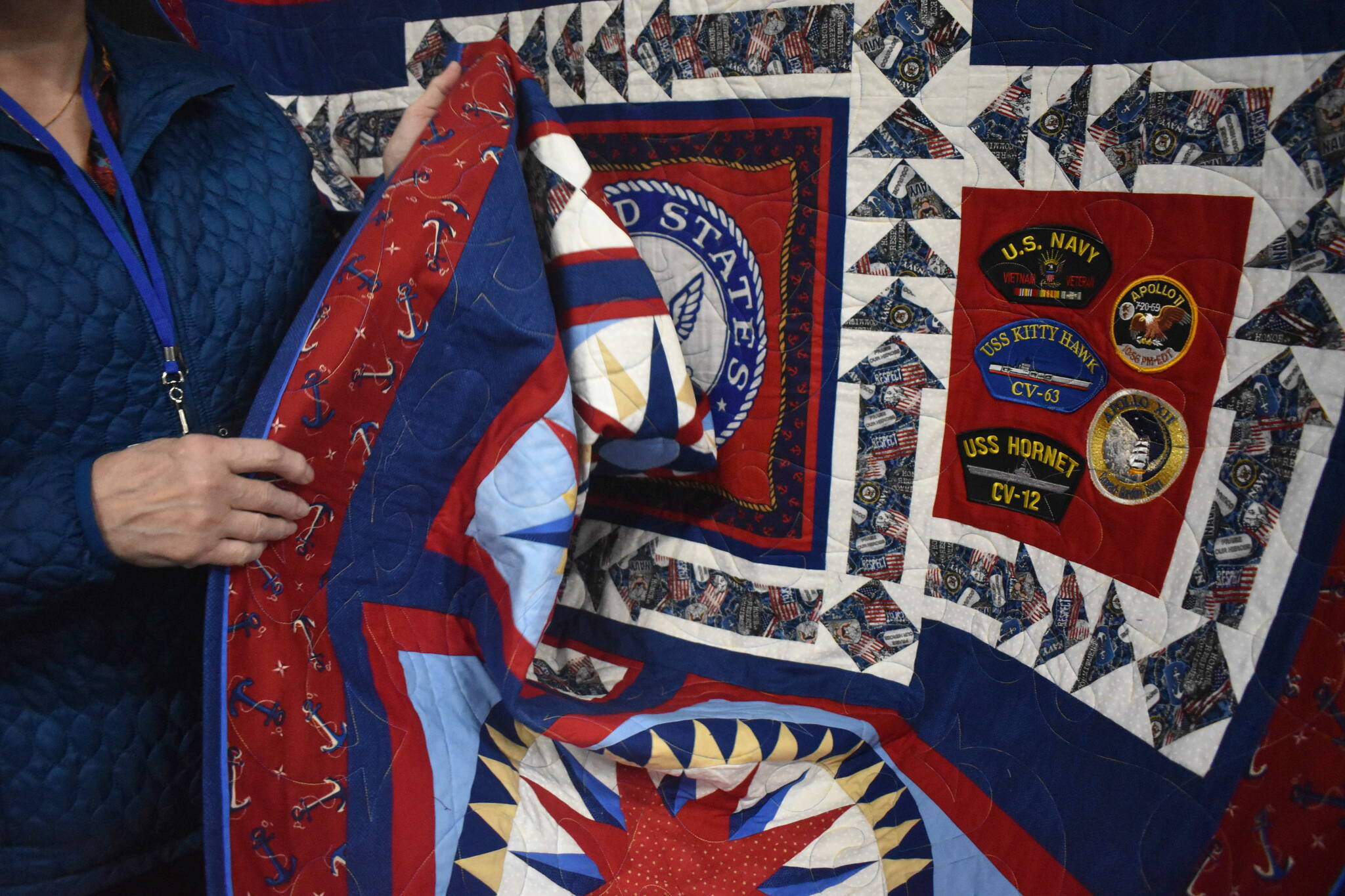 Pictured is Susanne Wick’s Quilt of Valor for her husband Robert Wick, commemorating his service in the U.S. Navy with real patches. Photo by Alex Bruell