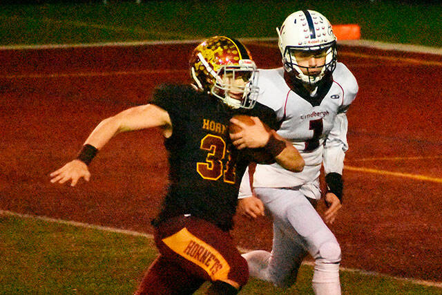 Enumclaw High dominated in all phases of the game Friday night, whipping the visiting Lindbergh Eagles 56-0 in a district football game. In this photo, Emmit Otero scoots for one of his first-half touchdowns. Photo by Kevin Hanson