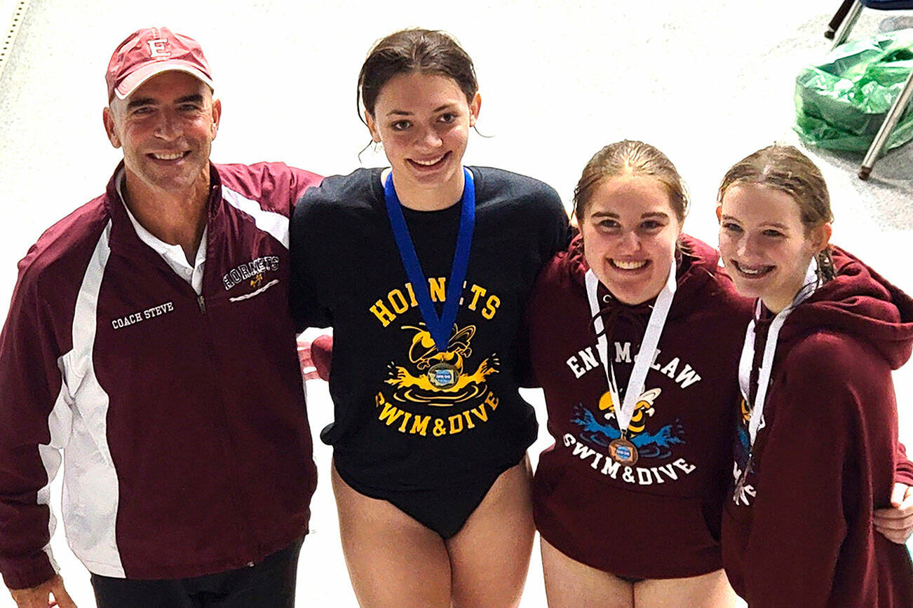 Plateau divers were a force at last week’s state swim and dive meet in Federal Way. Pictured here, from left, are coach Steve Bannerot; Enumclaw’s Naomi Prince, who won the state championship; Enumclaw’s Ashley Dickerson, third place; and White River’s Trista Turgeon, sixth place. Submitted photo