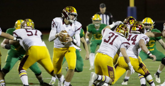 Photo courtesy Todd Overdorf / sonscapeimages.com/home
EHS was unstoppable; Lynden, immovable. In the end, one team had to give, and the Hornets were finally defeated after a stunning season. Pictured is quarterback Gunnar Tarachte looking to push through the Lions’ defenses.