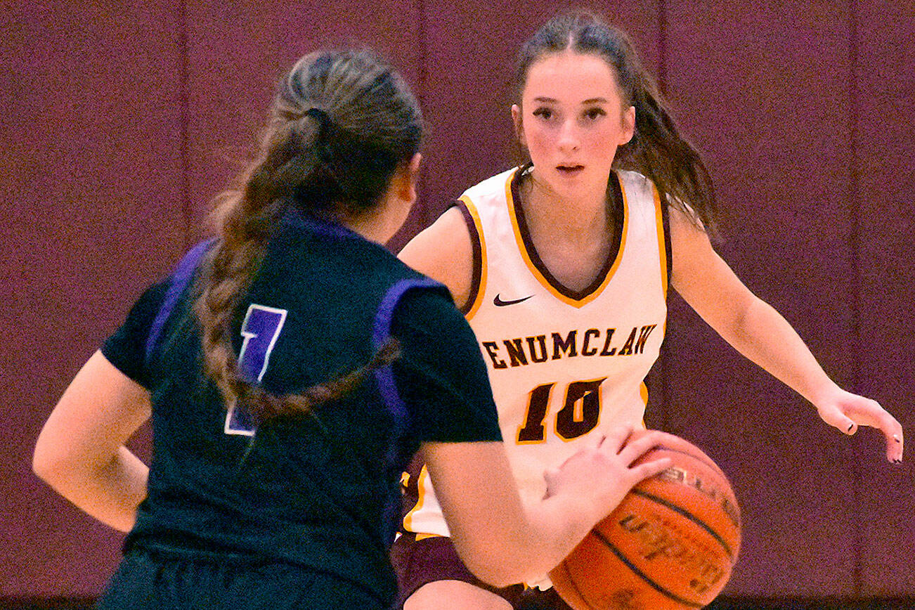 The Enumclaw High girls improved to 2-0 on the young season with a 53-35, home court victory over the Pasco Bulldogs. Pictured is senior Marissa Lindberg (10) applies defensive pressure to Prosser’s top scorer, Mireyah Lopez. Photo by Kevin Hanson