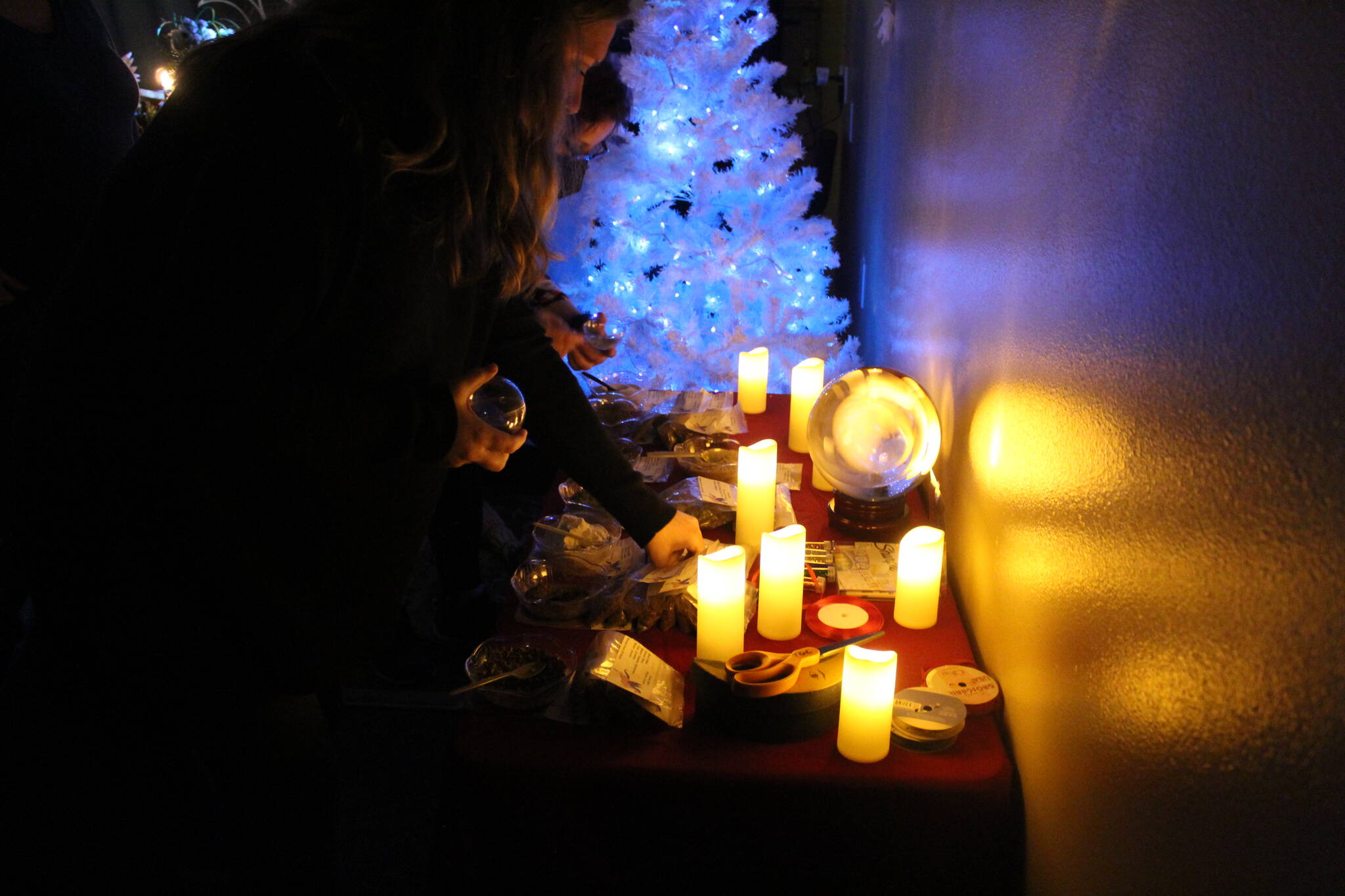 Guests at the Triple Goddess Coven make their own Witch Orbs to decorate their homes during the holidays. Photo by Bailey Jo Josie/Sound Publishing.