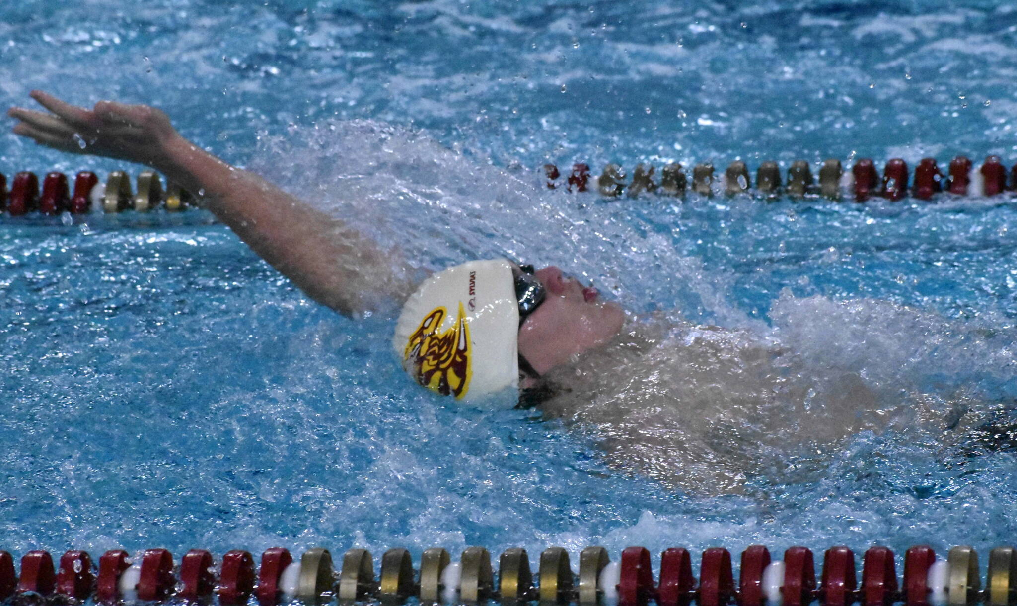 PHOTOS BY KEVIN HANSON The Enumclaw Aquatic Center played host the afternoon of Dec. 15 to a three-team swim meet that involved local athletes from Enumclaw and White River high schools, along with Tacoma’s Foss Falcons. In these photos, White River’s Evan Weisheyer competes in the 200-yard freestyle and Enumclaw’s McCade Walker takes part in the 100-yard backstroke. The Plateau athletes now take a break until Jan. 5 when they host the Franklin Pierce Cardinals and Washington Patriots.