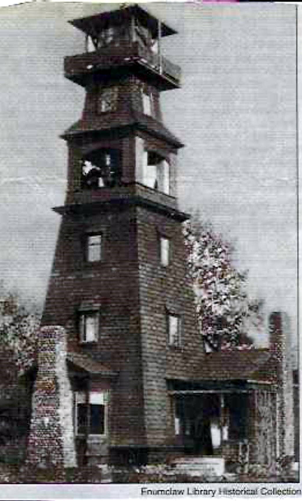 This photo, dated 1912, shows L. Robinson's tower. Image via Enumclaw Library Historical Collection.