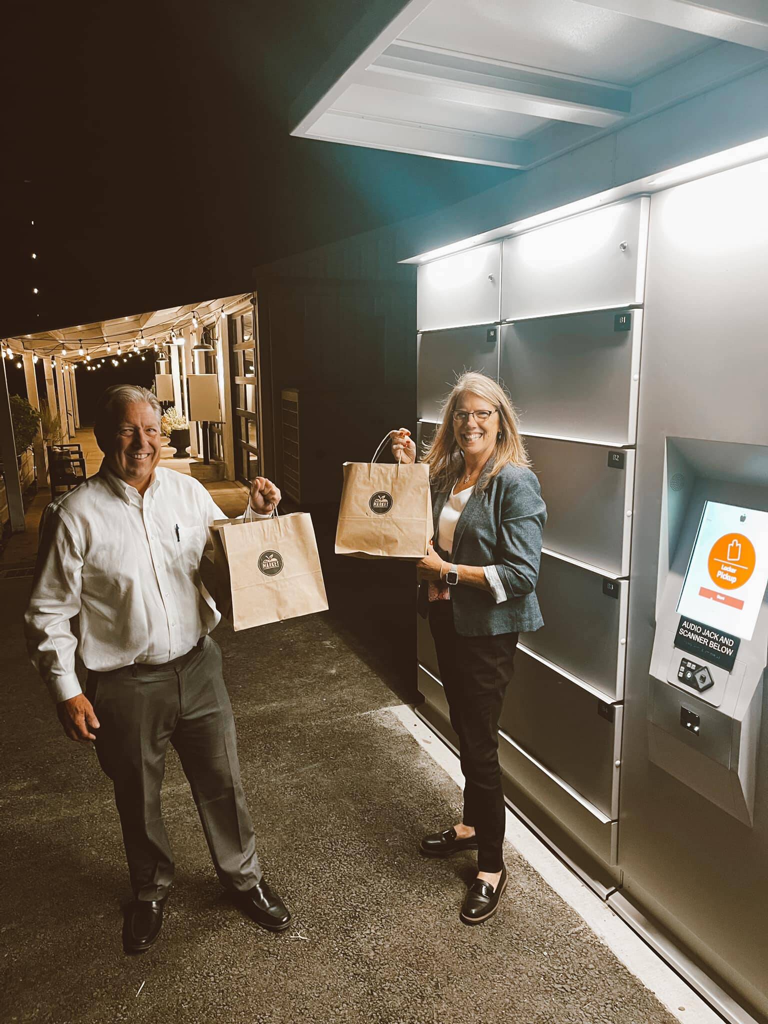 Courtesy photo
Pierce County Council member Dave Morell and his assistant Judy Hurley, who lobbied the county to fund The Market’s locker, pick up an order of fresh food.