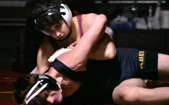 PHOTOS BY KEVIN HANSON 
White River wrestlers hosted the Lincoln Abes in a nonleague showdown the evening of Jan. 25. The visitors from Tacoma fared well in some of the lower weights but the Hornets proved too tough, eventually winning 54-30. Pictured here are sophomore Caleb Dale (white headgear) and freshman Josh Hanson (black headgear).