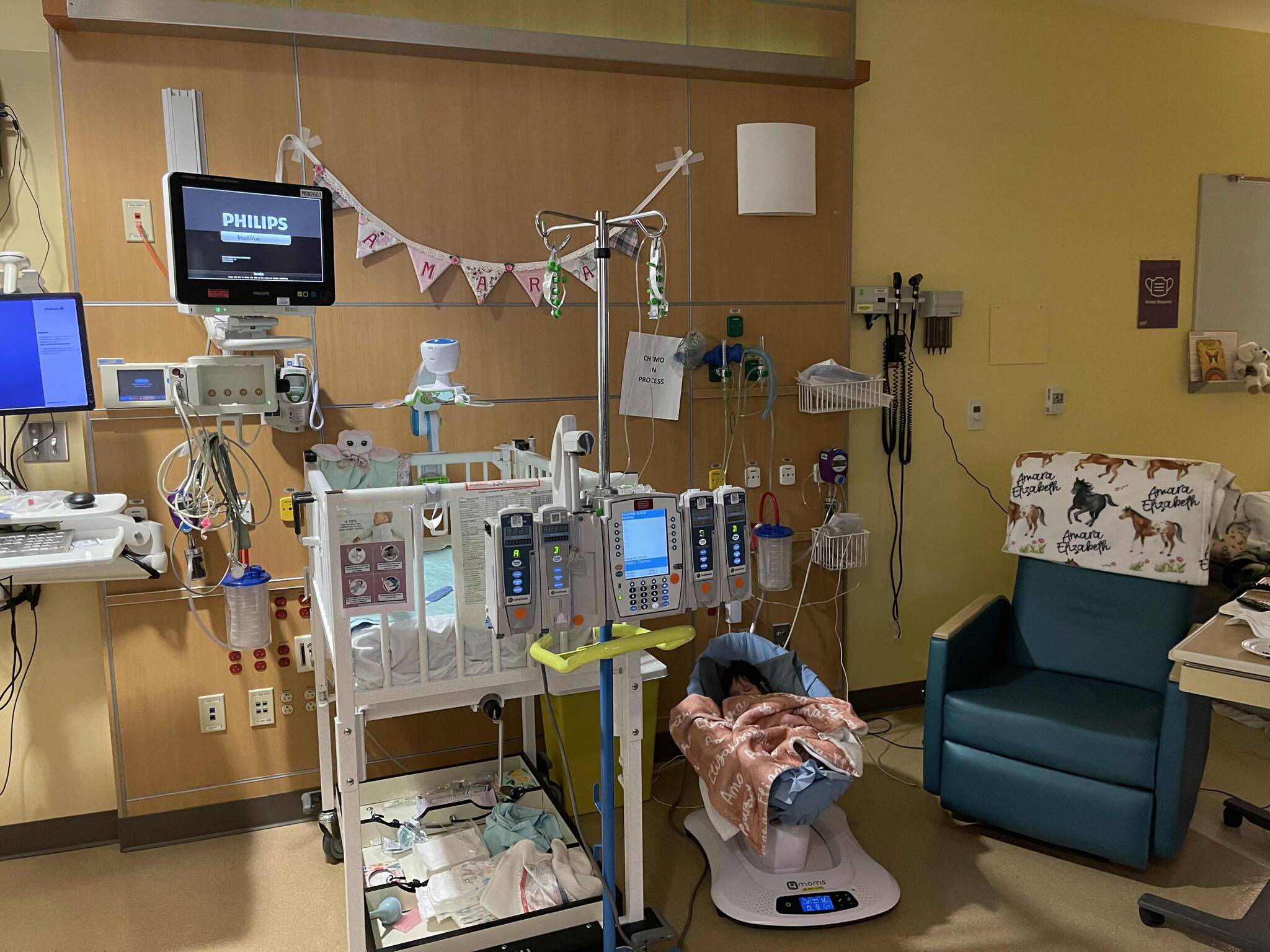 Amara Muntean sleeping in her hospital room, where she has to stay for at least 30 days at a time for her chemo treatment. Photo courtesy Megan Muntean