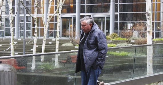 Photo by Ray Miller-Still 
Allan Thomas, former Drainage District 5 commissioner and Enumclaw dairy farmer, walks away from the Western District of Washington federal courthouse in Seattle. He was sentenced to 2.5 years in prison last Friday, Feb. 3, for his part in stealing more than $460,000 in taxes from locals.