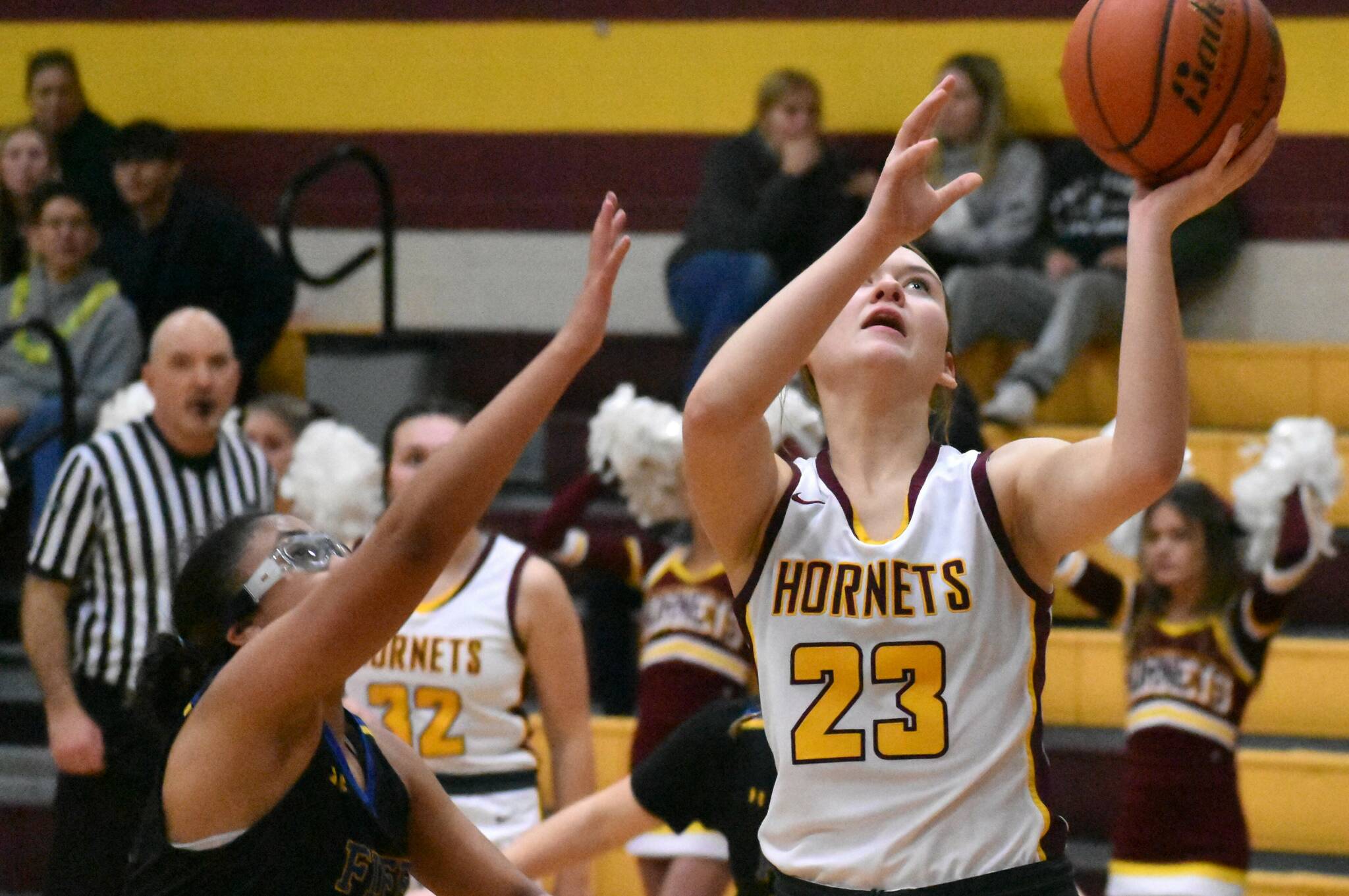 The White River High basketball teams swept a Friday night doubleheader against the visiting Fife Trojans. The Hornet girls opened with a lopsided win and the boys followed with a hard-fought victory. In this photo, Ally Green (24) goes to the hoop for two points. Photo by Kevin Hanson