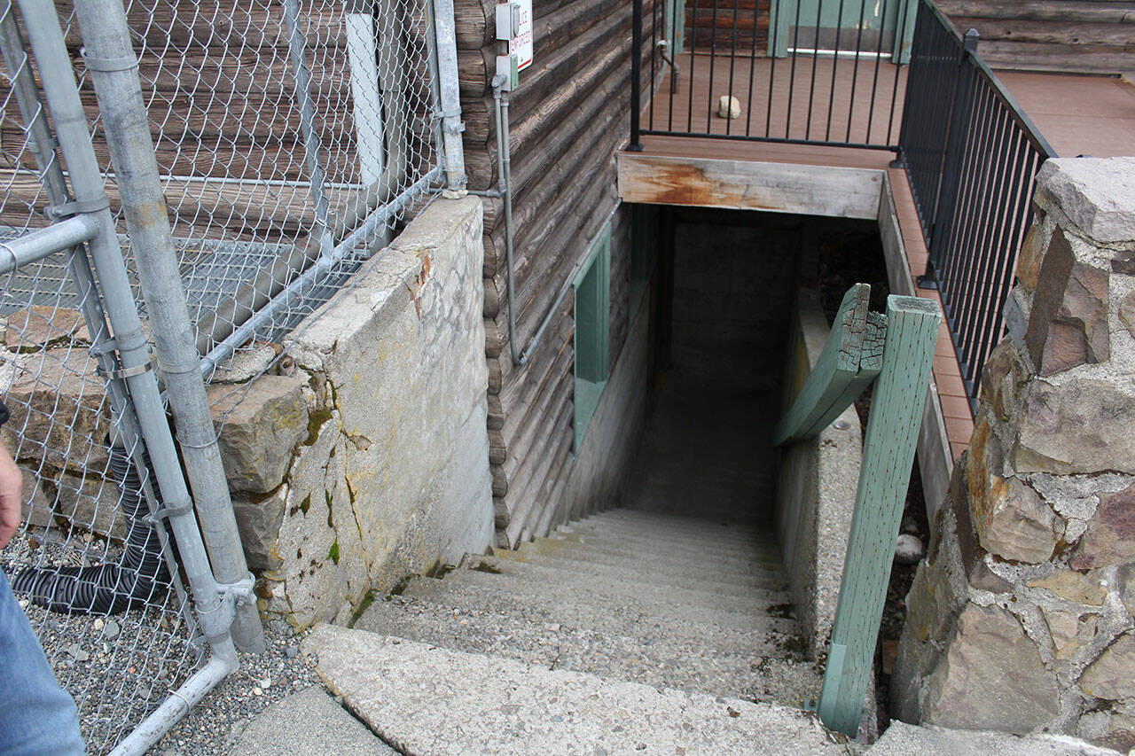 Leading down to the locker rooms is a dark stairwell, where athletes and coaches sometimes find sleeping bags, needles, and other detritis left by unhoused people. Photo by Ray Miller-Still