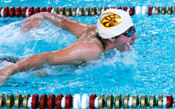 Swimmers from Enumclaw and White River high schools wrapped up the regular season Jan. 31 with a successful home meet against a combined Franklin Pierce/Washington squad. In this photo, Enumclaw’s Rishi Burt (white cap) competes in the butterfly leg of the medley relay. Photo by Kevin Hanson