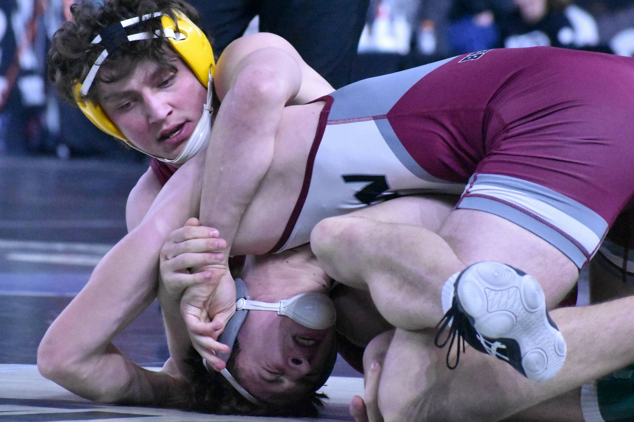White River senior Chase Campbell battles Waylen Land of W.F. West High during an opening-round state tourney match at 182 pounds. Campbell fell in his opener but bounced back with two victories on Friday. Photo by Kevin Hanson