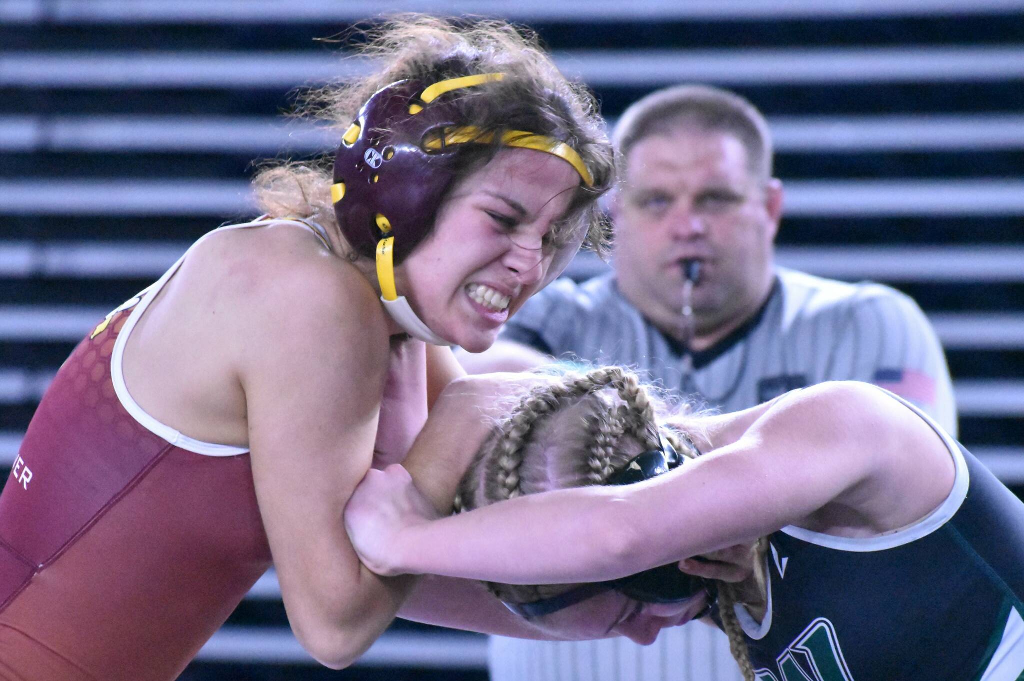White River junior Adriah Blue battles with Jersey O’Neill of Woodland in a 110-pound match. After splitting her first two matches, Blue dropped a 10-3 decision to O’Neill and was eliminated from the tournament. Photo by Kevin Hanson