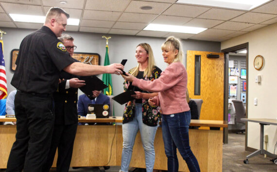 Photo by Ray Miller-Still
Enumclaw Fire Chief Randy Fehr and Deputy Chief Ben Hayman awarding Beth Madill and Lissa Strecker with their Citizen Lifesaving Awards.