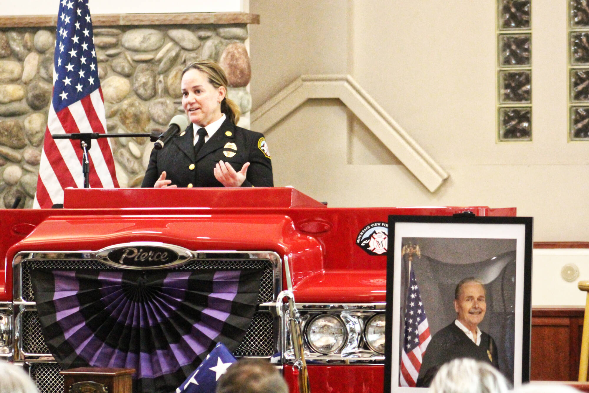 Mountain View Fire and Rescue’s new Fire Chief Dawn Judkins welcomed everyone to former Chief Greg Smith’s Celebration of Life service at the Muckleshoot Pentecostal Church last Monday. The service started out with an honor guard and procession bringing in an urn, flag, and firefighter helmet. Photos by Ray Miller-Still
