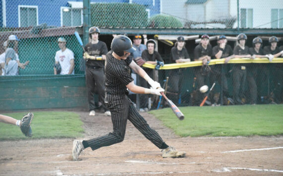 Photo by Kevin Hanson
The regular South Puget Sound League 2A season has wrapped up for most spring sports and postseason play awaits. Pictured here during a recent Enumclaw High School home baseball game is Casey Megargle putting a ball into play.