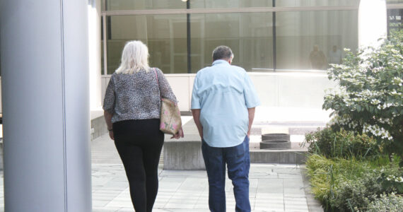 Joann and Allan Thomas leaving the federal court building in Seattle after being ordered to pay more than $926,000 in restitution and forfeiture for stealing local taxpayer money. Photo by Ray Miller-Still