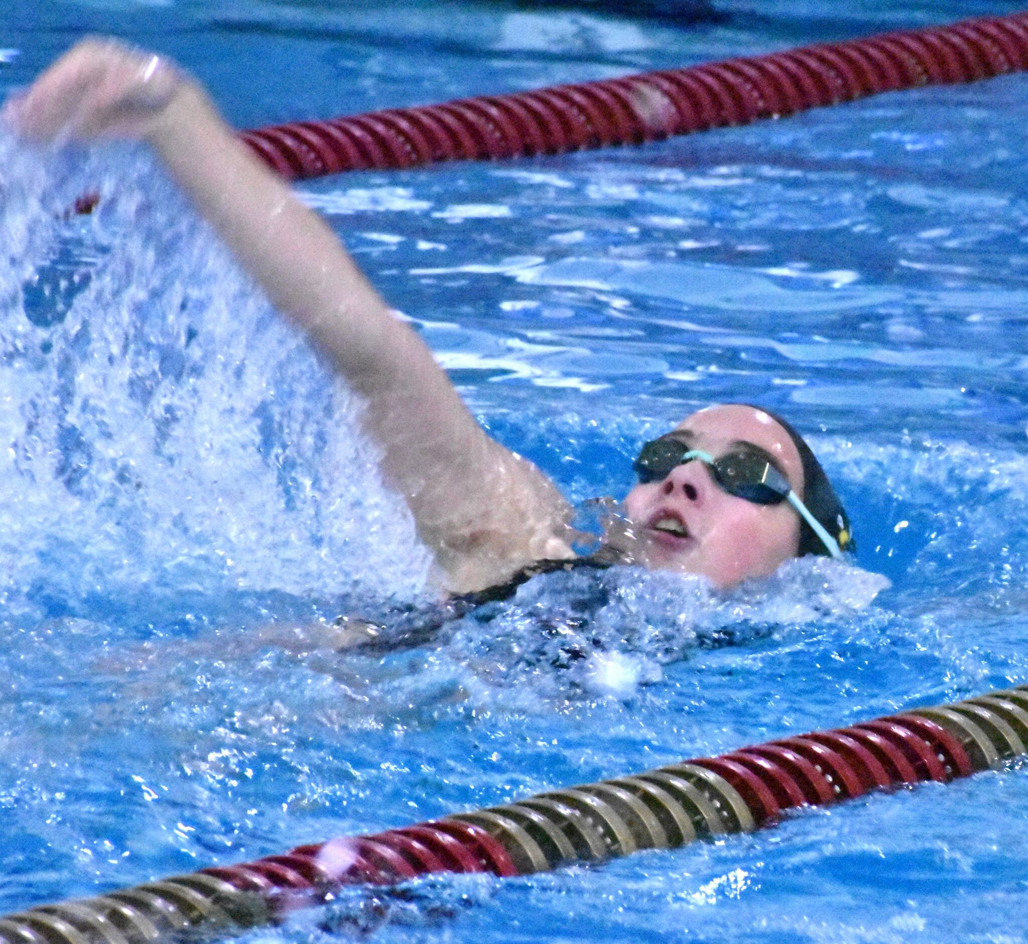 PHOTO BY KEVIN HANSON
Teams from Enumclaw, White River and Fife gathered September 14 at the Enumclaw Aquatic Center for an afternoon of competition. Pictured: EHS swimmer Alexandra Levesh swims the backstroke portion of the 200-yard individual medley which she won with a state-qualifying time. Meet details can be found in the Sports Roundup.