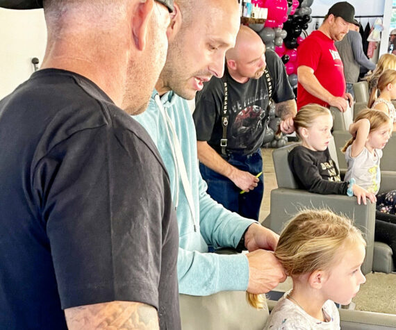 A group of fathers and their daughters at Salon Kathleen during a Daddy/Daughter Date Night, where dads learn how to do their kids’ hair. The quarterly classes are led by stylist Matt Fugate. Photo courtesy Samantha McCleary/ Samantha McCleary Photo