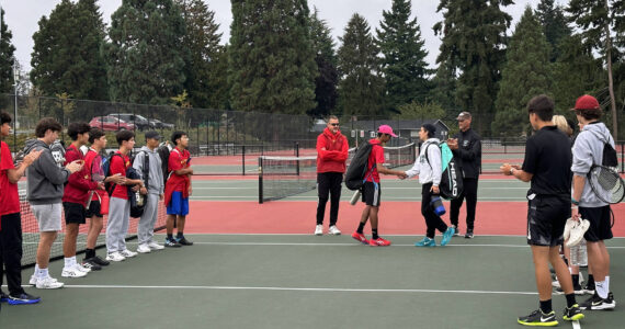 Gavin Orozco (Bonney Lake #1 Singles in white) shaking hands with Sanchit Sharma (Thomas Jefferson #1 Singles in red). Photo by Andy Orozco