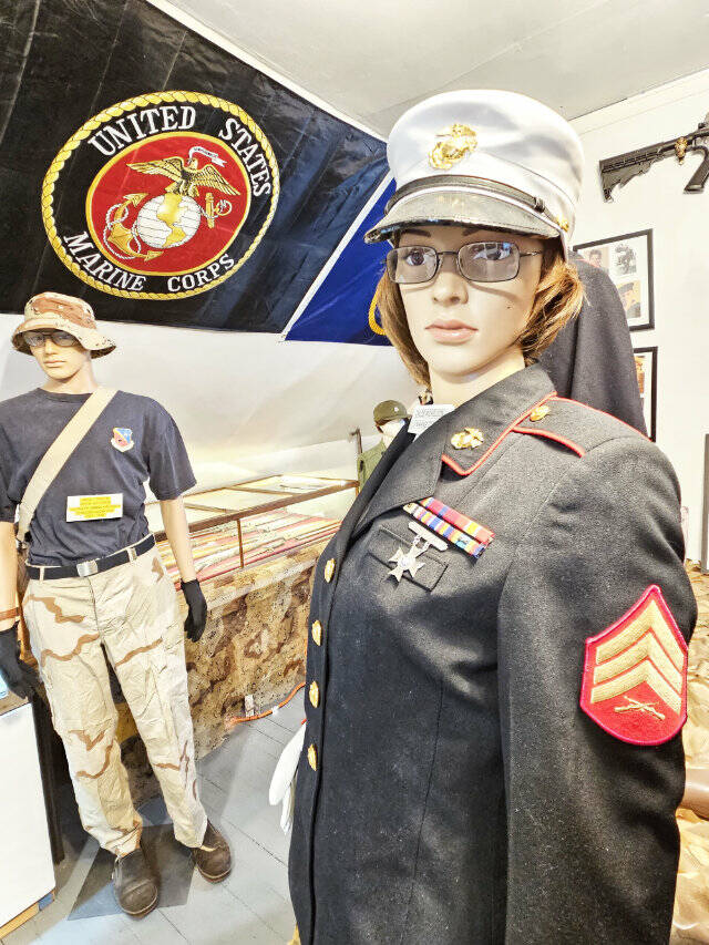 Some of the items featured is a WWI Purple Heart from Corporal John Abraham (above), the marine uniform of Buckley Senior Center Coordinator Chloe Mickelson, various models of planes and other memorabelia. Photo by Ray Miller-Still