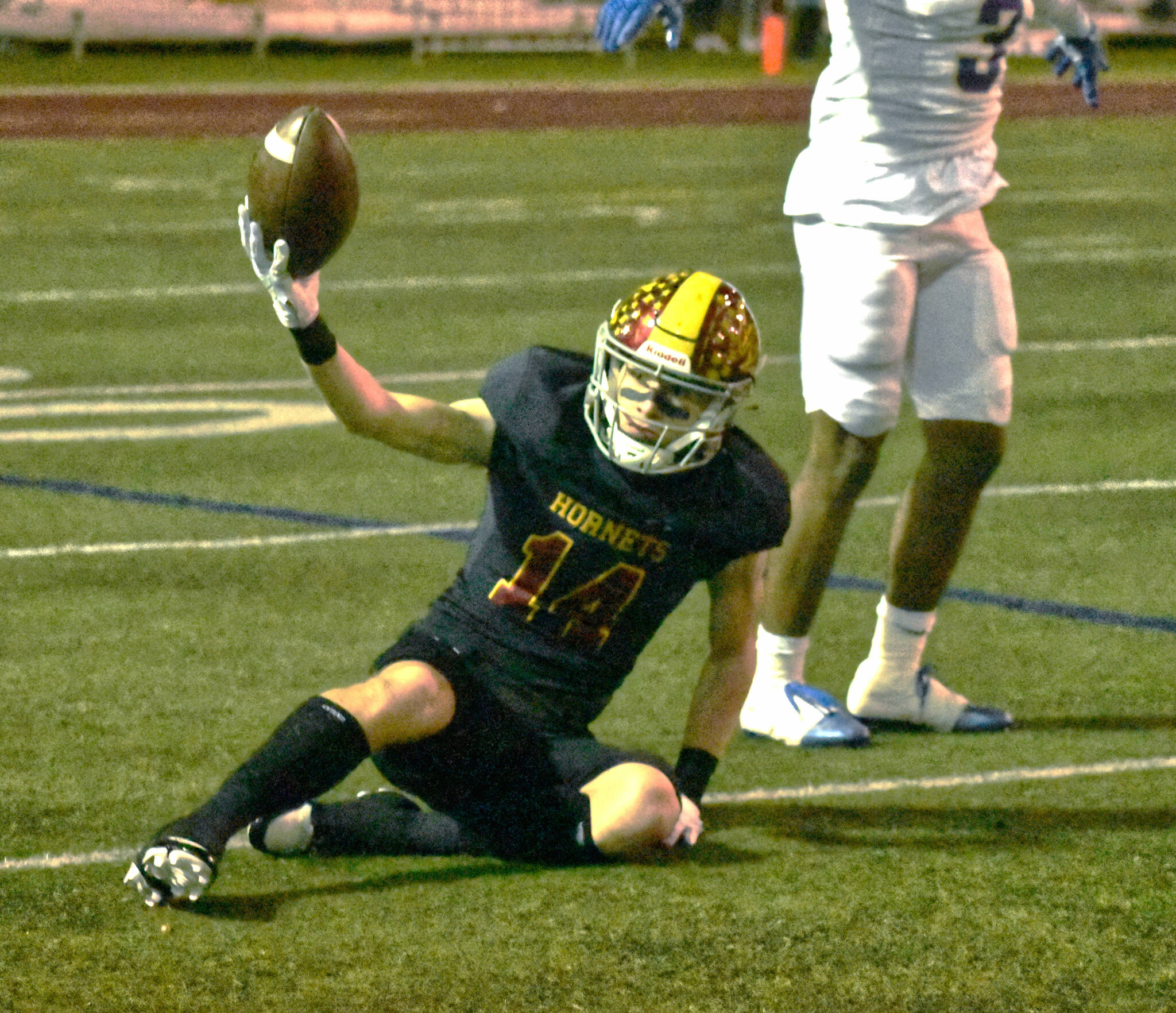 Photo by Kevin Hanson
Enumclaw High senior Landon Brauer was busy Friday night, helping the Hornets register a state quarterfinal victory over Highline. He’s shown here celebrating a long pass reception (which was nullified by penalty).