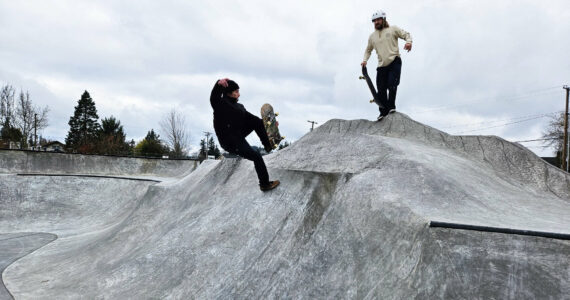 Kasey Craft, in the white, and Joseff Kushmaul, in black, were two of the first people to get rolling on Enumclaw's new skatepark. Photo by Ray Miller-Still