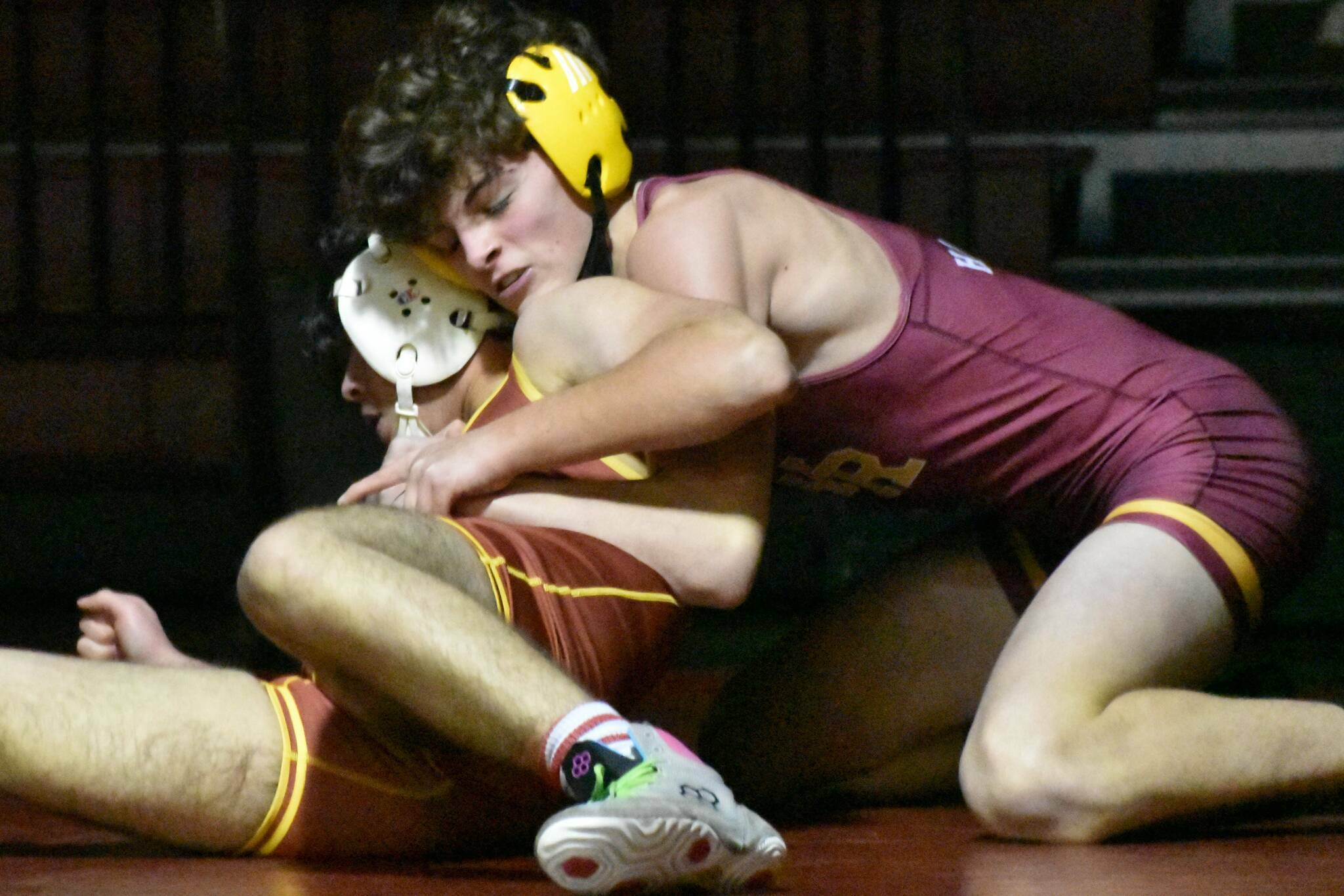 WRs Hunter Oswold (yellow headgear) gets the better of his EHS opponent during a Jan. 18, 2023 match against Enumclaw High. Photo by Kevin Hanson
