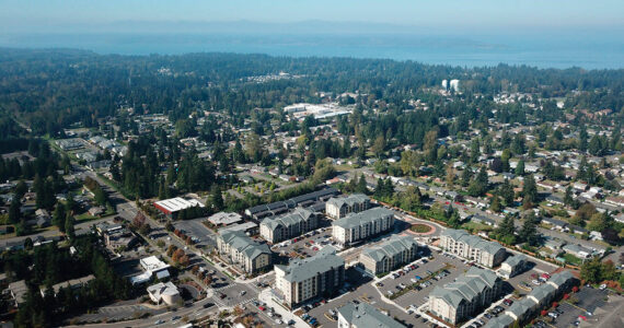 Washington faces a housing shortage, needing more than 1 million homes in the next 20 years to meet the demand, according to the Department of Commerce. Pictured: Bird’s eye view of apartments and single-family homes in Federal Way, Washington. (Photo courtesy of Bruce Honda)
