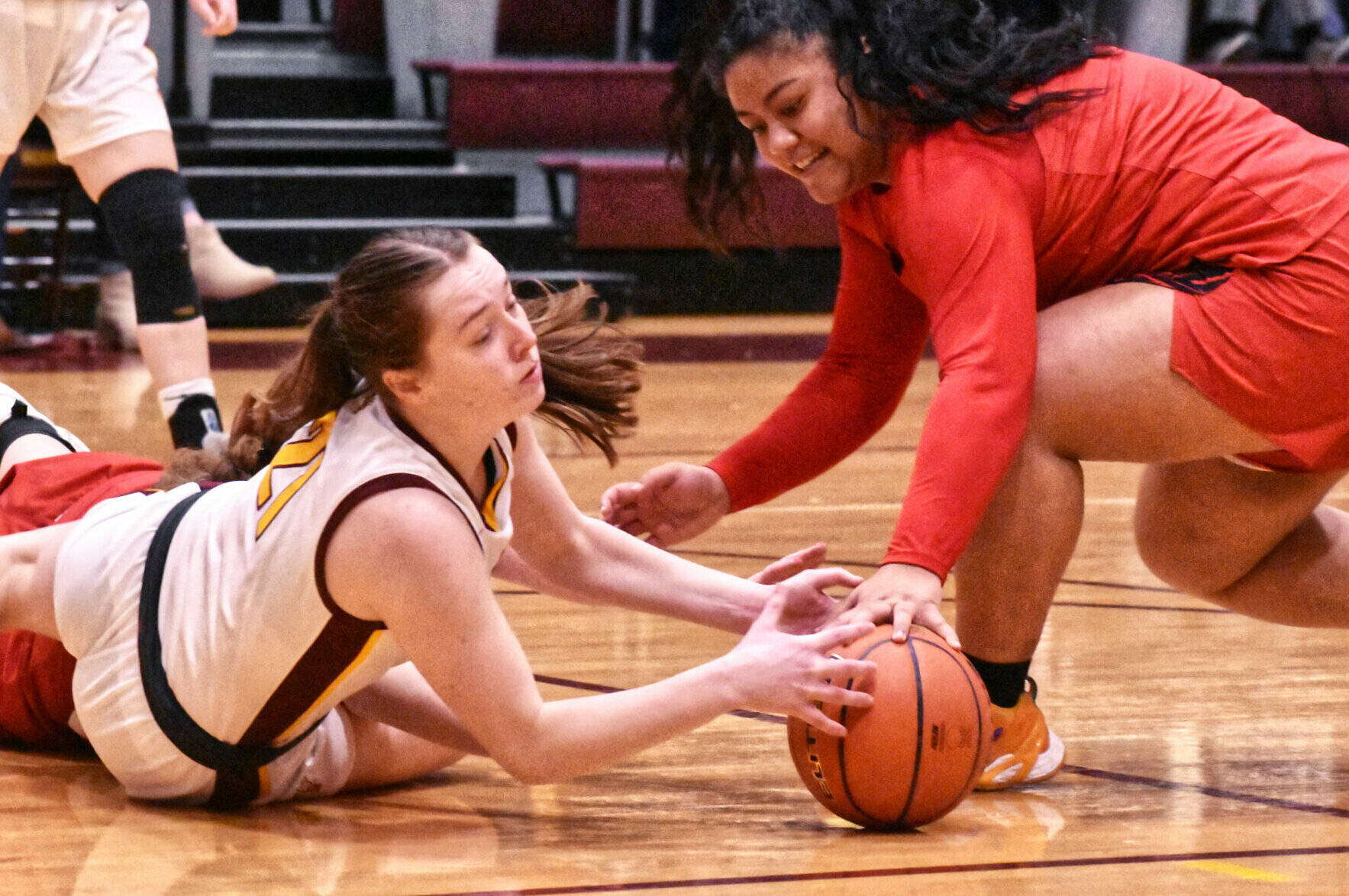 The White River High basketball teams swept their Franklin Pierce guests Friday night. The Hornet girls opened the hoop doubleheader with a lopsided 65-17 victory and the boys followed with a 77-62 win. Pictured is White River’s Ava Bright hitting the floor during a scramble for a loose ball. Photo by Kevin Hanson