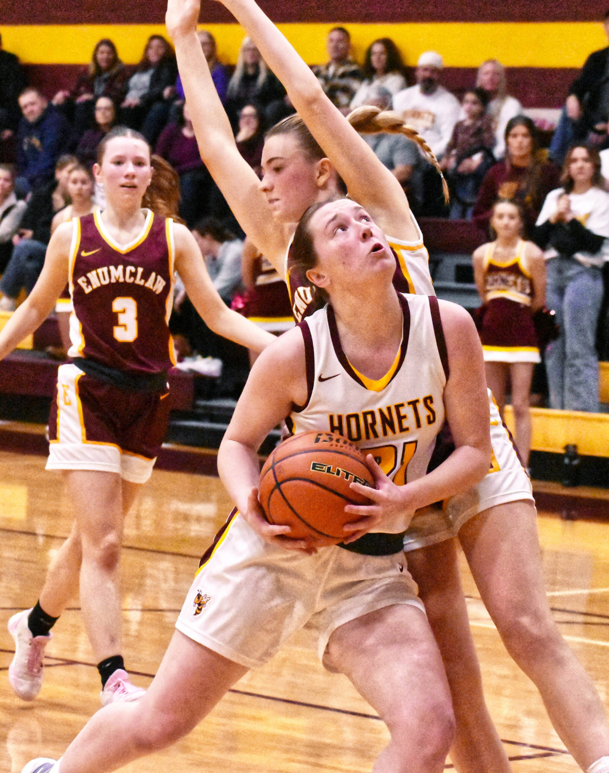 White River’s Ava Bright slips past an Enumclaw defender on her way to the hoop during her team’s January 10, home-court victory. Photo by Kevin Hanson