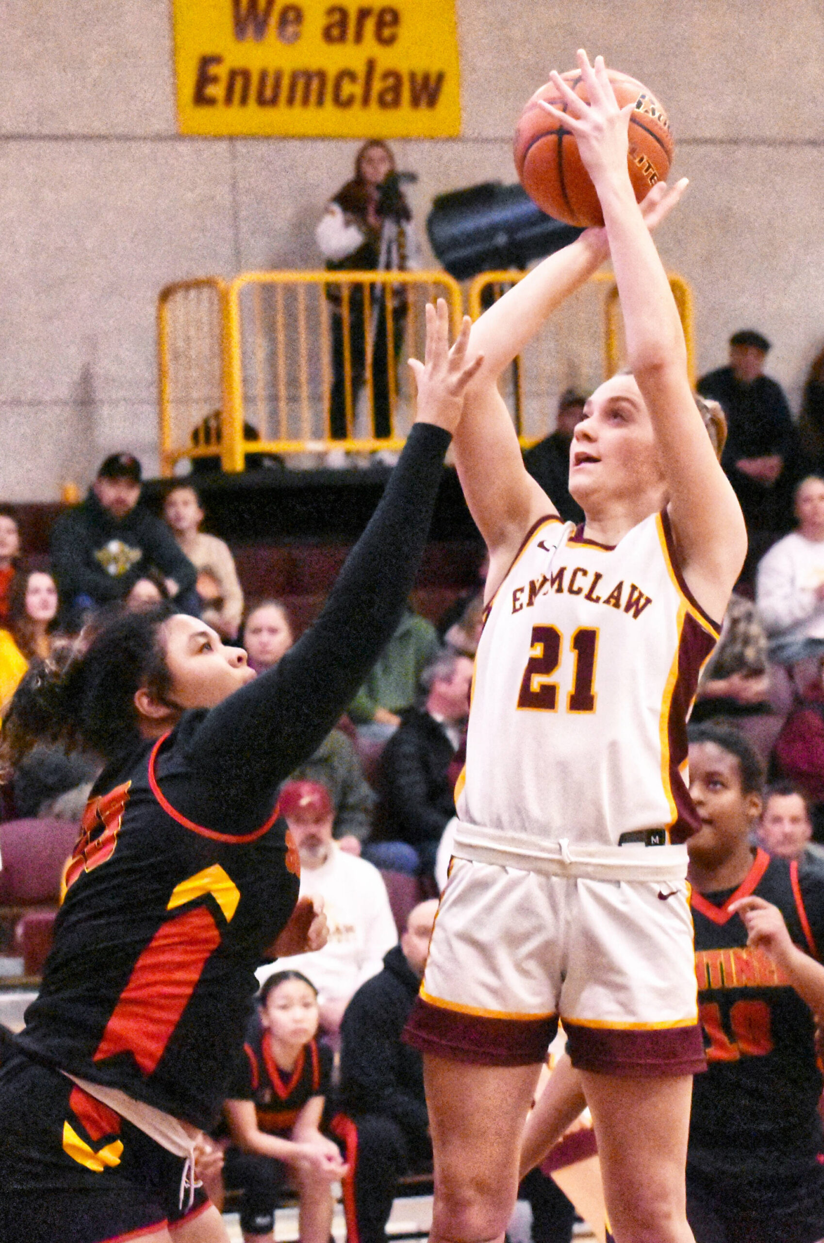 Bella Firnkoess (21) puts up a jump shot on the way to a game-high 20 points. Photo by Kevin Hanson