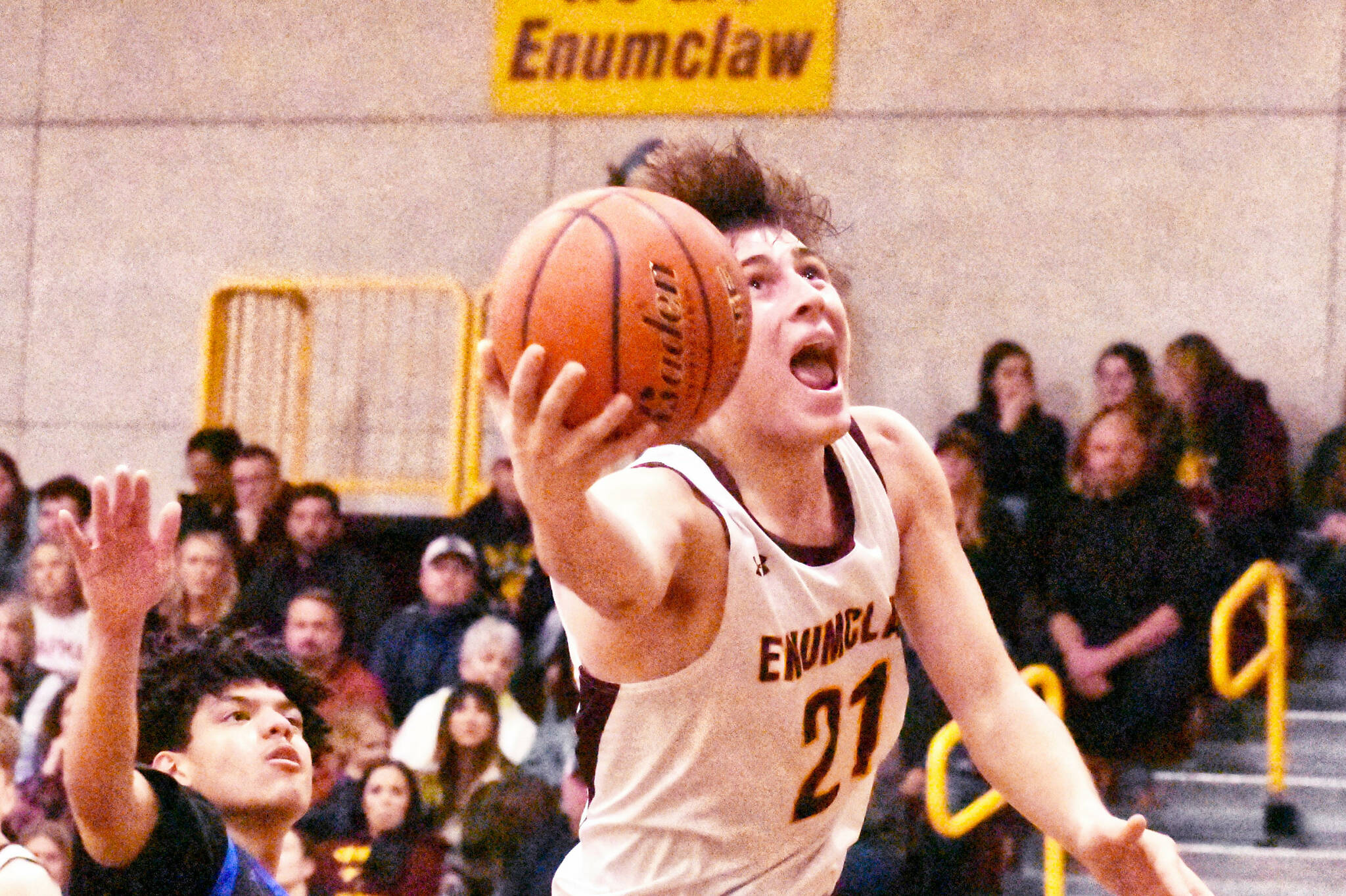 A third-quarter offensive outburst turned the tide Saturday evening and propelled the Enumclaw boys to a 68-44 victory over visiting Washington High. The Patriots walked into Chuck Smith Gymnasium with a lowly 1-16 season record but gave the Hornets all they could handle during the early going. EHS had a slim 29-27 halftime lead before romping to a 24-7 third-quarter advantage and never looking back. The win pushed Enumclaw’s record to 10-3 in SPSL 2A play and 12-6 overall. In this photo, Karson Holt drives for two of his game-high 19 points.
Photo by Kevin Hanson