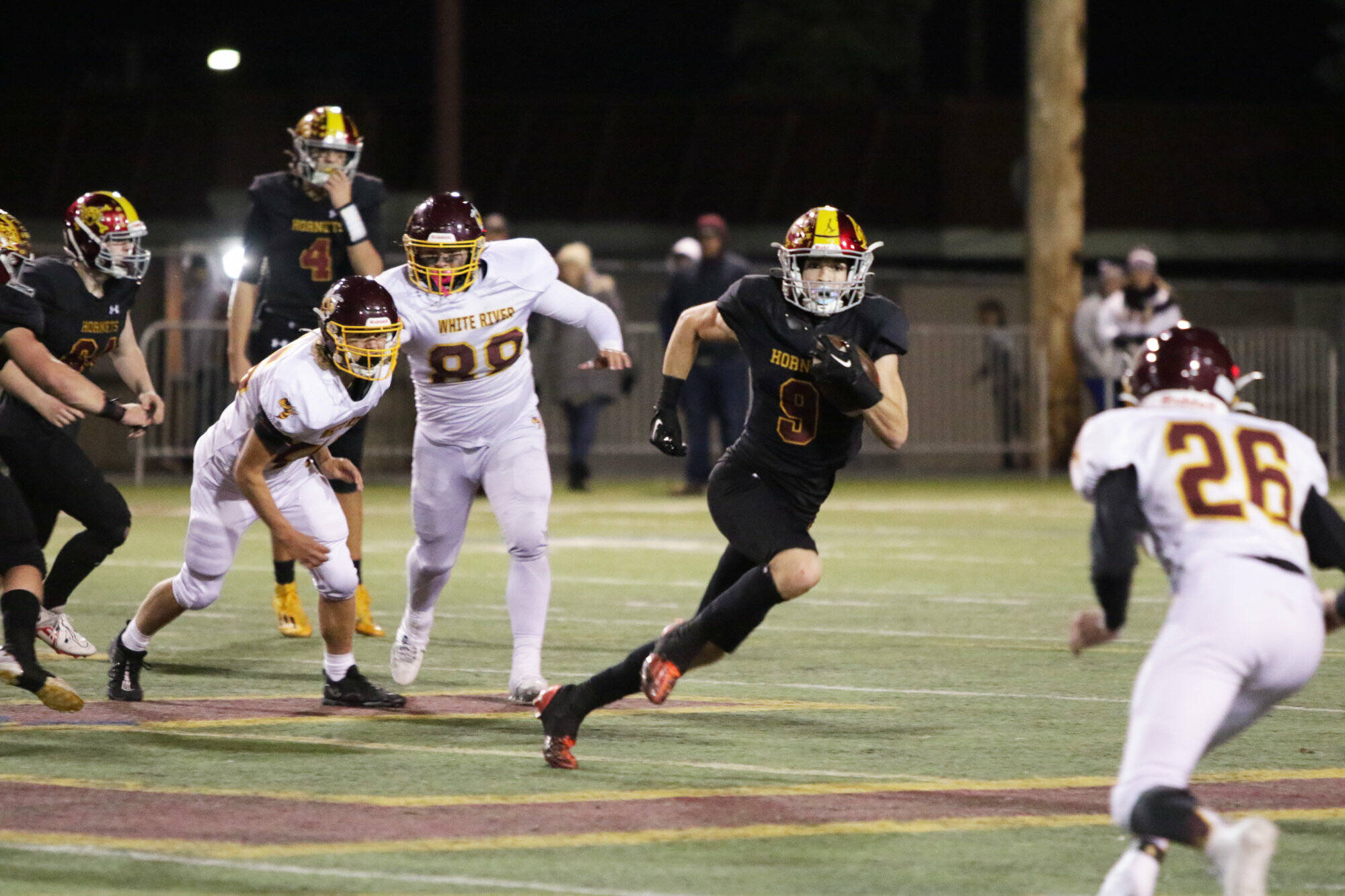 Photo by Todd Overdorf/SonScape Images
#9 Wyatt Neu speeds to the edge for another Enumclaw first down in the 2023 Battle of the Bridge game against White River.