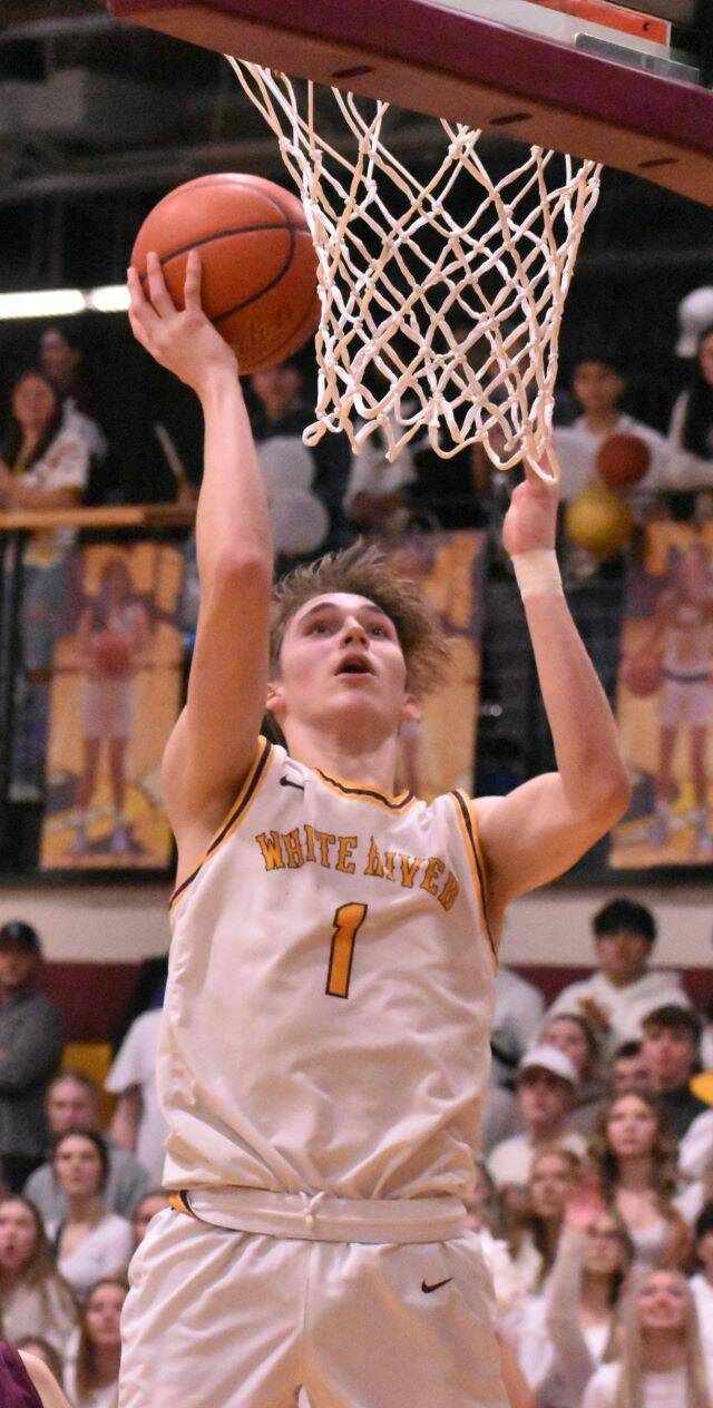 White River’s Ben Berg goes high for an uncontested bucket during Thursday night’s victory over Enumclaw High. Photo by Kevin Hanson