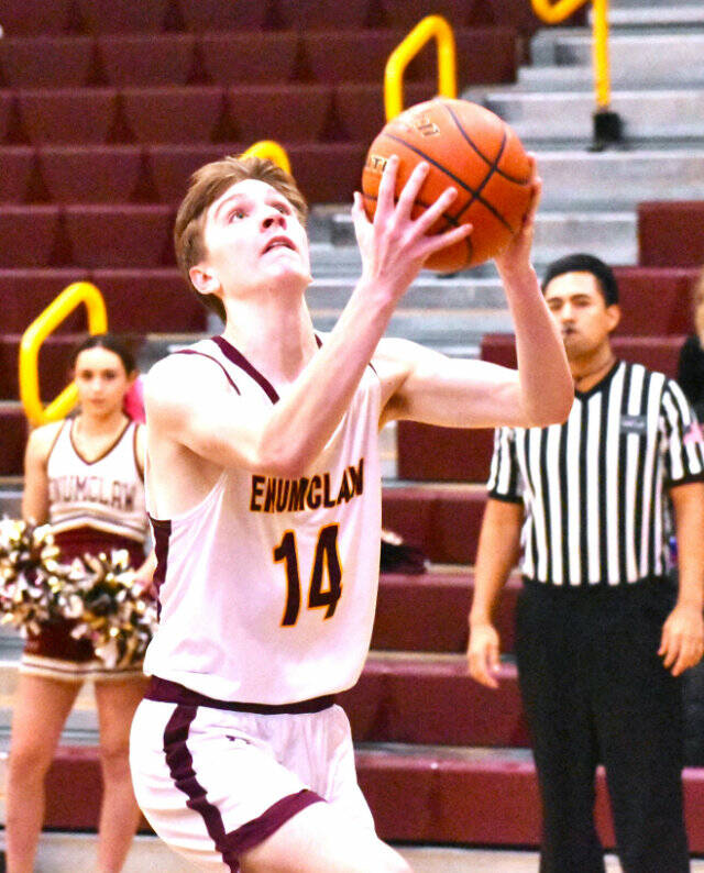 The Enumclaw High boys’ basketball team advanced to the state Sweet 16 thanks to three victories in the District 2/3 tournament. Here, Landon Brauer finishes a breakaway layin during the Hornets’ February 13, home court victory over North Mason. Photo by Kevin Hanson