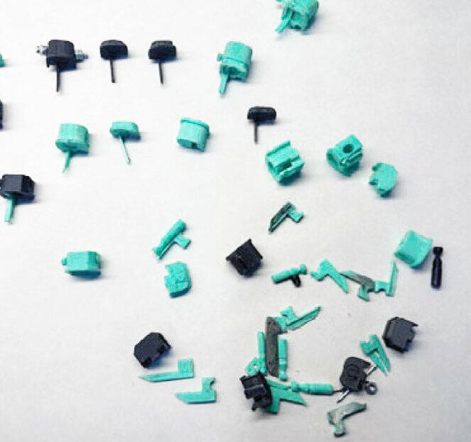 Photos courtesy the Department of Justice
Law enforcement allegedly confiscated Glock “conversion” devices that would turn the semi-automatic weapon into an automatic weapon, as well as several privately-made automatic firearms (or “ghost guns”) when they raided Ross Heinzinger and Ashley Lewis’ Black Diamond apartment.