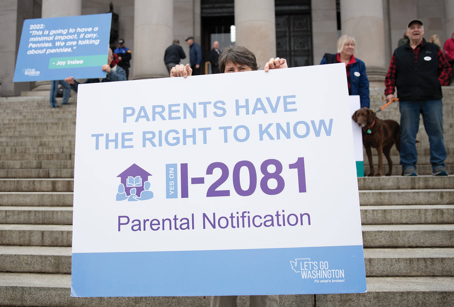 Photo by Mary Murphy
Demonstrators carry signs calling for passage of a parental notification initiative during a protest in Olympia. The initiative was approved by the Legislature.